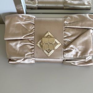 BCBGMAXAZRIA clutch in ivory sateen color